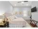 Neutral bedroom with plush bedding, hardwood floors, and natural light at 991 Metropolitan Sw Pkwy, Atlanta, GA 30310