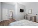 Stylish bedroom with hardwood floors, a mounted TV, and calming decor at 991 Metropolitan Sw Pkwy, Atlanta, GA 30310