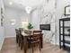 Dining room with decorative wall and modern lighting fixtures at 991 Metropolitan Sw Pkwy, Atlanta, GA 30310