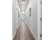 Long hallway featuring hardwood floors and neutral paint throughout at 991 Metropolitan Sw Pkwy, Atlanta, GA 30310
