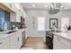 Bright kitchen featuring white cabinets, modern appliances, and subway tile backsplash at 991 Metropolitan Sw Pkwy, Atlanta, GA 30310