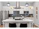 Modern kitchen featuring stainless appliances, white cabinetry, and a functional center island at 991 Metropolitan Sw Pkwy, Atlanta, GA 30310