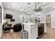 Open-concept living area with modern finishes, island seating, and living room at 991 Metropolitan Sw Pkwy, Atlanta, GA 30310