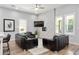 Comfortable living room with contemporary decor, large windows, and modern accent wall at 991 Metropolitan Sw Pkwy, Atlanta, GA 30310