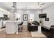 Stylish living room and eat-in kitchen featuring a modern island, sleek finishes, and built in appliances at 991 Metropolitan Sw Pkwy, Atlanta, GA 30310