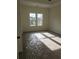 A bright, carpeted bedroom with two large windows providing lots of natural light at 4011 Redan Rd # 9, Stone Mountain, GA 30083