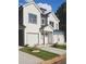 New construction home with white and gray siding, a one car garage, and landscaping at 4011 Redan Rd # 9, Stone Mountain, GA 30083