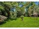 Spacious backyard with a swing set and lush green grass at 4742 West Dr, Forest Park, GA 30297