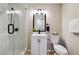 Bathroom features white subway tile walls, a glass-enclosed shower, and a modern vanity at 4742 West Dr, Forest Park, GA 30297
