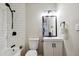 Bright renovated bathroom with white subway tile, and updated black hardware at 4742 West Dr, Forest Park, GA 30297