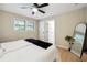 Bedroom with hardwood floors, ceiling fan, and ensuite bathroom at 4742 West Dr, Forest Park, GA 30297