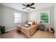 Charming bedroom with light-filled windows and a ceiling fan at 4742 West Dr, Forest Park, GA 30297