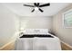 Bedroom with hardwood floors, ceiling fan and large windows at 4742 West Dr, Forest Park, GA 30297