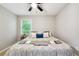Bedroom with large windows and neutral decor with hardwood floors at 4742 West Dr, Forest Park, GA 30297