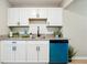 Kitchen featuring white cabinets, granite countertops and modern appliances at 4742 West Dr, Forest Park, GA 30297