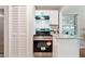 Updated kitchen with white cabinets, granite countertops, and stainless steel appliances at 4742 West Dr, Forest Park, GA 30297