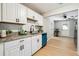 Kitchen featuring white cabinets, modern appliances and granite countertops at 4742 West Dr, Forest Park, GA 30297