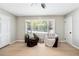 Bright living room featuring wood floors, and large windows at 4742 West Dr, Forest Park, GA 30297