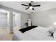 Bright main bedroom featuring a ceiling fan, hardwood floors and a neutral paint color at 4742 West Dr, Forest Park, GA 30297