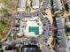 Aerial view of a community swimming pool surrounded by parking, landscaping, and apartment buildings at 6851 Ne Roswell Rd # C4, Atlanta, GA 30328