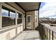 Balcony with white door, metal railings, and view of the street and landscaping at 6851 Ne Roswell Rd # C4, Atlanta, GA 30328