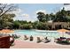 Community pool with lounge chairs and umbrellas for relaxing poolside on sunny days at 6851 Ne Roswell Rd # C4, Atlanta, GA 30328