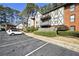 Charming exterior features a classic design, a balcony, and well-maintained landscaping at 6851 Ne Roswell Rd # C4, Atlanta, GA 30328