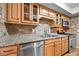 Updated kitchen features stainless steel appliances, granite counters, and a stylish backsplash at 6851 Ne Roswell Rd # C4, Atlanta, GA 30328