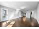 Open-concept living room featuring hardwood floors, recessed lighting, and neutral color palette at 6851 Ne Roswell Rd # C4, Atlanta, GA 30328