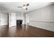 Comfortable living room with a fireplace, hardwood floors, and a ceiling fan at 6851 Ne Roswell Rd # C4, Atlanta, GA 30328