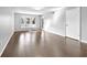 Bright, airy living room with hardwood floors, bay window, and neutral wall color at 6851 Ne Roswell Rd # C4, Atlanta, GA 30328