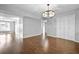 Spacious living area with hardwood floors and modern lighting at 6851 Ne Roswell Rd # C4, Atlanta, GA 30328