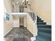 Condo entrance with staircase, wrought iron railing, and tiled floor at 6851 Ne Roswell Rd # C4, Atlanta, GA 30328