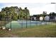 A fenced tennis court provides recreational opportunities for residents in a community setting at 6851 Ne Roswell Rd # C4, Atlanta, GA 30328