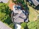 Overhead aerial view of a home with mature trees, a private backyard, and a well-maintained roof at 10635 Sugar Crest Ave, Johns Creek, GA 30097
