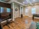 Finished basement with wood look flooring, foosball table, and large screen television at 10635 Sugar Crest Ave, Johns Creek, GA 30097