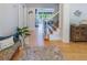 Elegant foyer with hardwood floors, staircase, stylish furnishings, and natural light streaming in at 10635 Sugar Crest Ave, Johns Creek, GA 30097