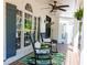 Relaxing front porch featuring rocking chairs, stylish decor, and ample space to unwind at 10635 Sugar Crest Ave, Johns Creek, GA 30097