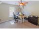 Office with a desk, computer monitors, and carpeted flooring at 10635 Sugar Crest Ave, Johns Creek, GA 30097