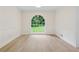 Inviting dining room with an arched window and modern flooring, creating an elegant space at 2040 Sunrise Cir, Cumming, GA 30040