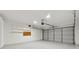 Spacious two car garage with automatic door and plenty of storage space on attached shelving at 2040 Sunrise Cir, Cumming, GA 30040
