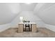 Bright home office with a modern white desk and chair, perfect for a workspace in a cozy setting at 2040 Sunrise Cir, Cumming, GA 30040