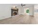 Spacious living room features a fireplace, large arched window, and modern flooring at 2040 Sunrise Cir, Cumming, GA 30040