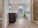 The bathroom offers double sinks, tile flooring, a soaking tub, and a glass-enclosed shower at 1477 Harlequin Way, Stockbridge, GA 30281