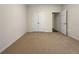 Neutral bedroom with closet and door leading to additional living space at 1477 Harlequin Way, Stockbridge, GA 30281