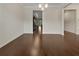 Elegant dining room with hardwood floors and a stylish chandelier, perfect for entertaining guests at 1477 Harlequin Way, Stockbridge, GA 30281