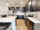 Modern kitchen with dark cabinets, white countertops, and stainless steel appliances at 1604 Driggs Nw Dr # 160, Atlanta, GA 30318