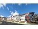 Modern townhomes with professional landscaping, and mixed material exteriors under a blue sky at 1604 Driggs Nw Dr # 160, Atlanta, GA 30318