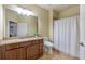 Bathroom with a large mirror, granite countertop, and white shower curtain at 2703 Brookhavenrun Cir, Duluth, GA 30097
