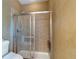 Bathroom featuring a glass shower, tile floors, and neutral decor at 2703 Brookhavenrun Cir, Duluth, GA 30097